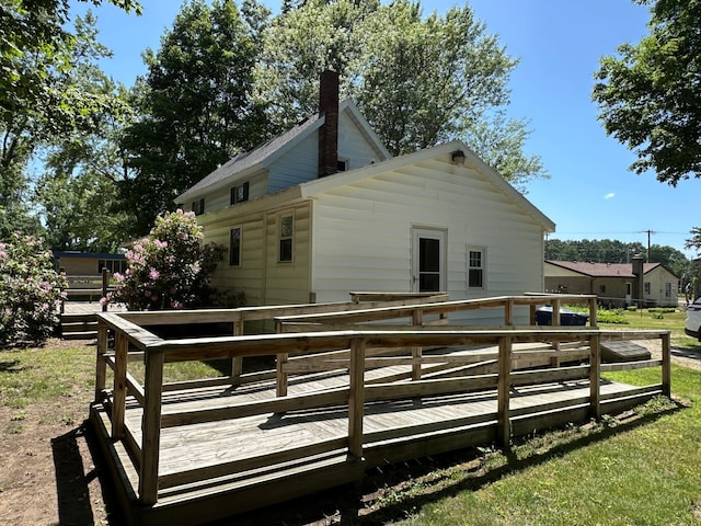 4641 Territorial Rd, Benton Harbor, MI 49022 - back of property with a wooden deck and a chimney