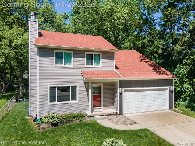646 Alan Dr, Lake Orion, MI 48362 - traditional home featuring a chimney, a garage, concrete driveway, and a shingled roof