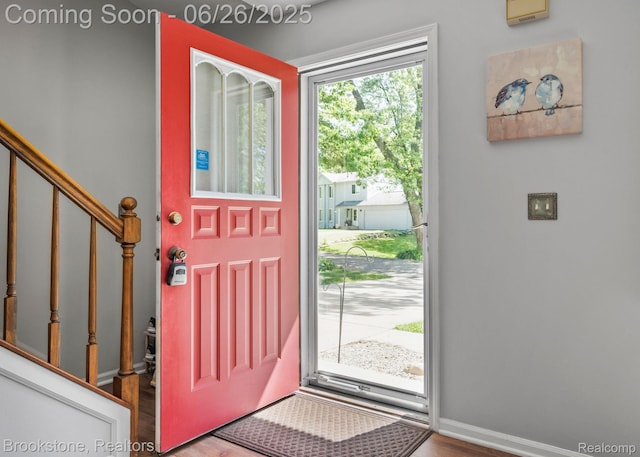 646 Alan Dr, Lake Orion, MI 48362 - entryway featuring wood finished floors and stairs