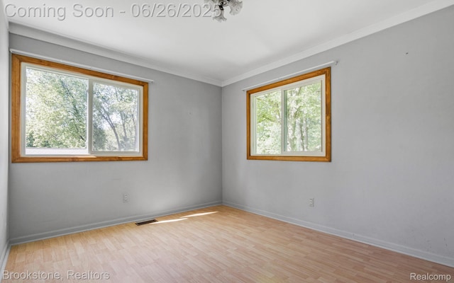 646 Alan Dr, Lake Orion, MI 48362 - spare room featuring crown molding and wood finished floors