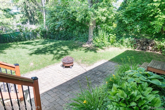 646 Alan Dr, Lake Orion, MI 48362 - view of yard with an outdoor fire pit and a patio area