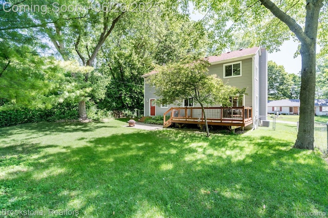 646 Alan Dr, Lake Orion, MI 48362 - view of yard featuring a wooden deck and an outdoor fire pit