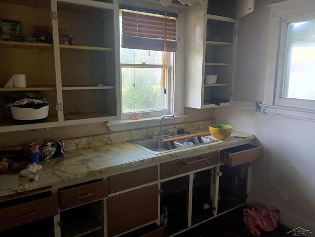 1507 Barnard St, Saginaw, MI 48602 - kitchen featuring open shelves, healthy amount of natural light, and light countertops