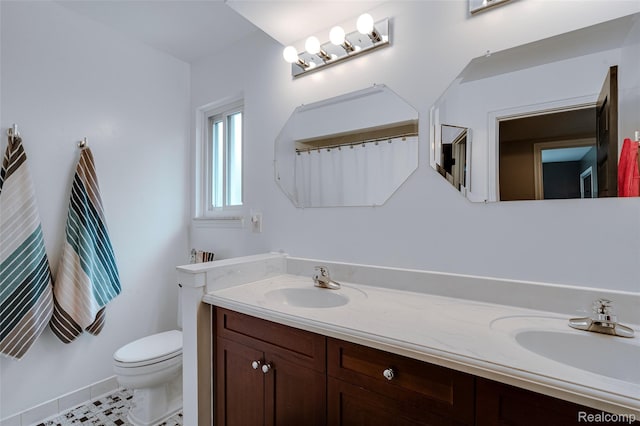 6848 Chadwick Dr, Canton, MI 48187 - bathroom featuring double vanity and toilet