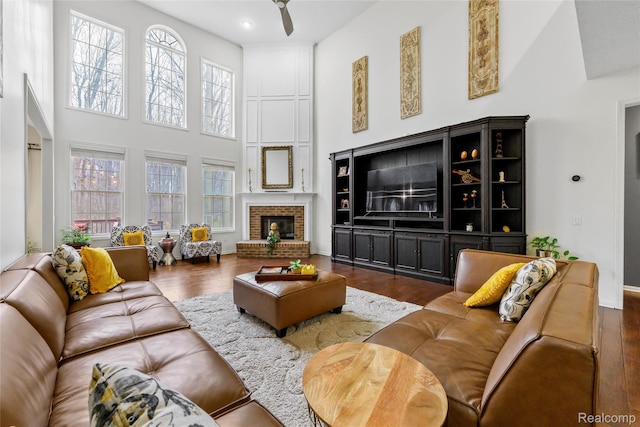 1249 Lasalle Rd, Canton, MI 48187 - living area featuring a high ceiling, wood finished floors, ceiling fan, and a brick fireplace