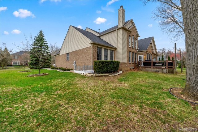 1249 Lasalle Rd, Canton, MI 48187 - rear view of property featuring brick siding, a chimney, a wooden deck, and a lawn