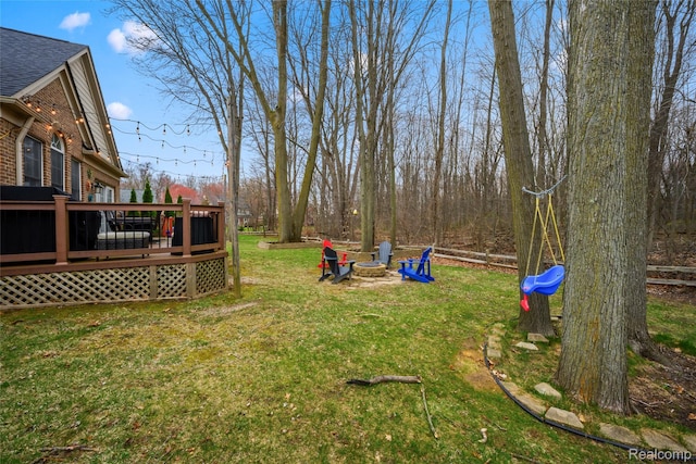 1249 Lasalle Rd, Canton, MI 48187 - view of green lawn with a wooden deck and an outdoor fire pit