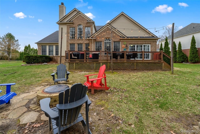1249 Lasalle Rd, Canton, MI 48187 - rear view of property with a fire pit, brick siding, a lawn, and a chimney