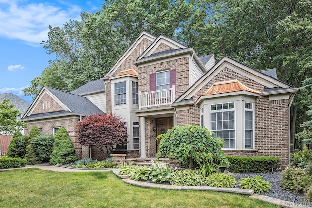 1249 Lasalle Rd, Canton, MI 48187 - view of front facade featuring brick siding, a balcony, a shingled roof, and a front yard