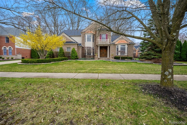 1249 Lasalle Rd, Canton, MI 48187 - view of front of home with a front yard, brick siding, and a balcony
