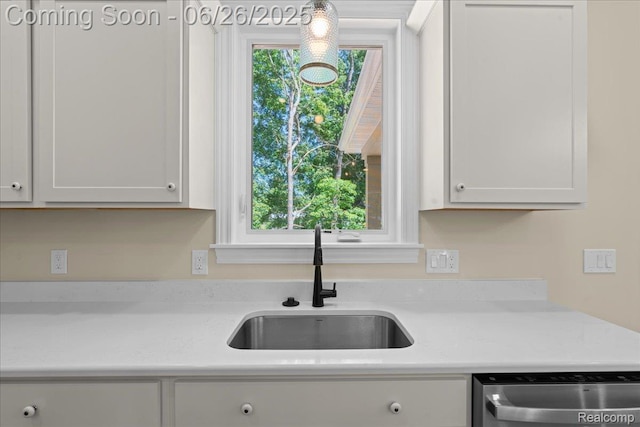 917 Chickasaw Dr, Mason, MI 48854 - kitchen featuring dishwashing machine and light countertops