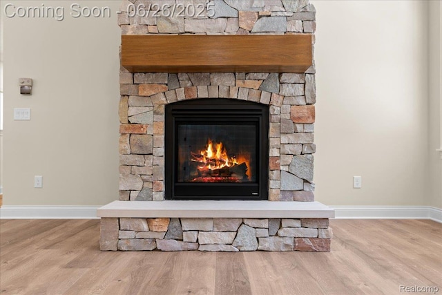 917 Chickasaw Dr, Mason, MI 48854 - detailed view of wood finished floors and a stone fireplace