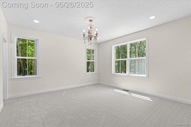 917 Chickasaw Dr, Mason, MI 48854 - carpeted spare room with a chandelier, healthy amount of natural light, and recessed lighting