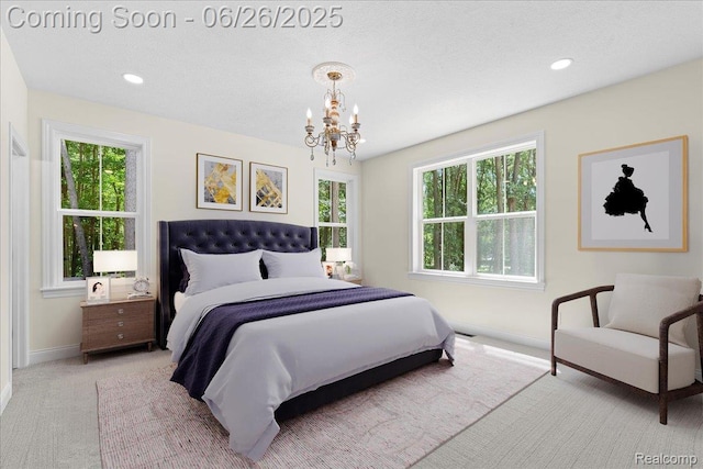 917 Chickasaw Dr, Mason, MI 48854 - carpeted bedroom featuring a chandelier and recessed lighting
