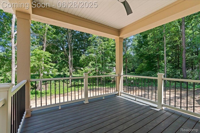 917 Chickasaw Dr, Mason, MI 48854 - wooden deck featuring ceiling fan and view of scattered trees