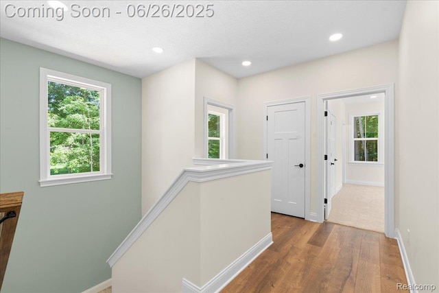 917 Chickasaw Dr, Mason, MI 48854 - corridor with wood finished floors, recessed lighting, and an upstairs landing