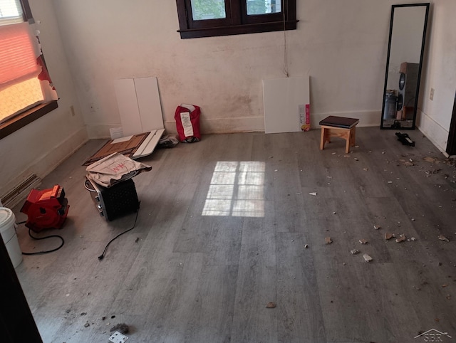 1907 N Clinton St, Saginaw, MI 48602 - empty room with wood finished floors