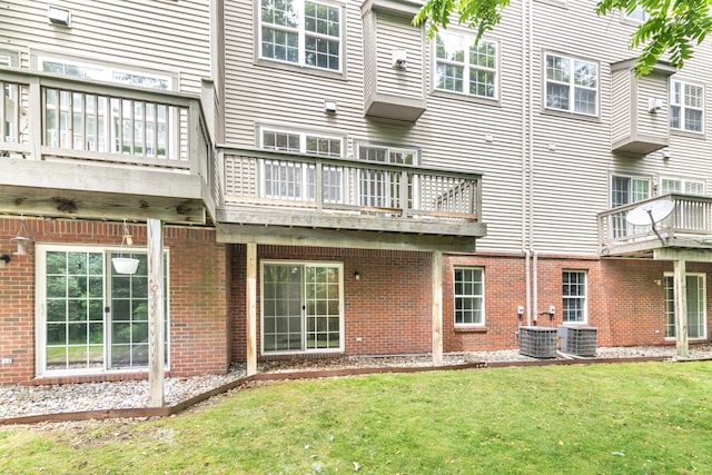 3046 Barclay Way, Ann Arbor, MI 48105 - back of property featuring a balcony, a lawn, and brick siding