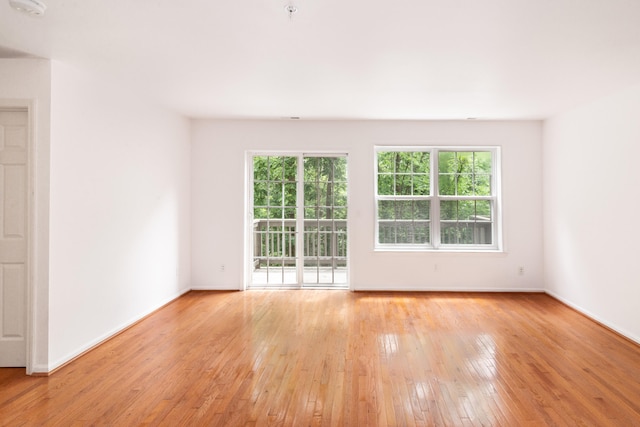 3046 Barclay Way, Ann Arbor, MI 48105 - unfurnished room featuring light wood finished floors, a smoke detector, and a pendent fire sprinkler