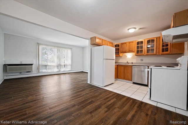 1565CHERBONEAU Cherboneau Pl Unit 52, Detroit, MI 48207 - kitchen with white appliances, range hood, a baseboard heating unit, glass insert cabinets, and light wood-style flooring