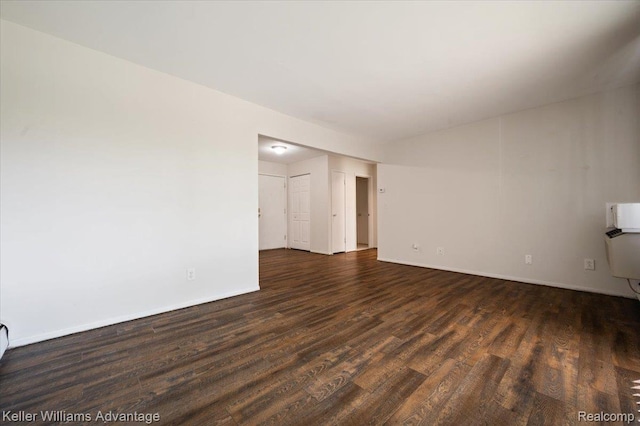 1565CHERBONEAU Cherboneau Pl Unit 52, Detroit, MI 48207 - unfurnished living room with wood finished floors and baseboards