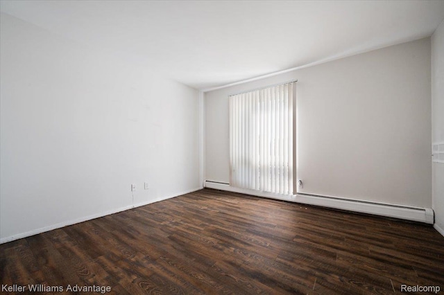 1565CHERBONEAU Cherboneau Pl Unit 52, Detroit, MI 48207 - spare room featuring baseboard heating and wood finished floors