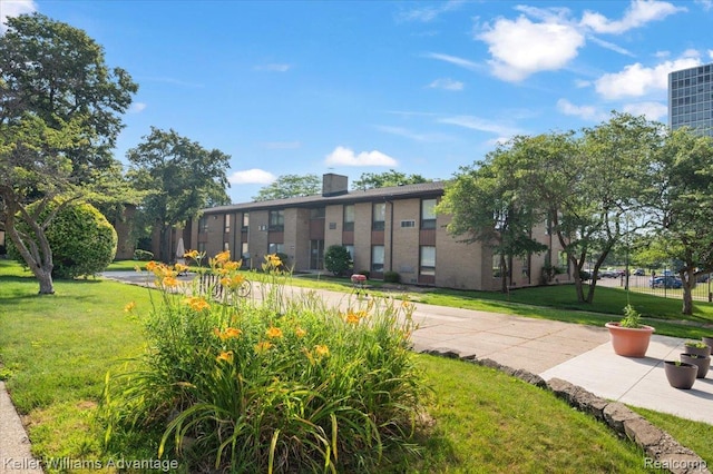 1565CHERBONEAU Cherboneau Pl Unit 52, Detroit, MI 48207 - view of community featuring a yard
