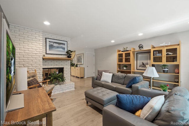 1122 Meadowglen Ct, Bloomfield Hills, MI 48304 - living room featuring light wood-type flooring, recessed lighting, and a brick fireplace