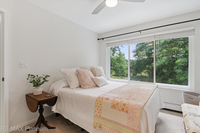 5959 Alan Dr Unit 53, Brighton, MI 48116 - bedroom featuring baseboard heating, ceiling fan, and carpet