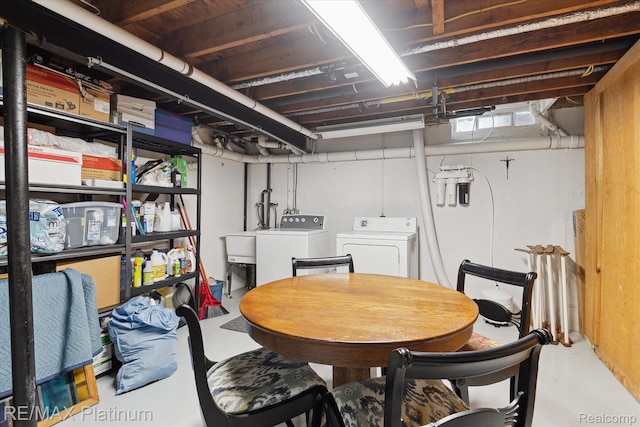 5959 Alan Dr Unit 53, Brighton, MI 48116 - dining room featuring washing machine and dryer and finished concrete floors