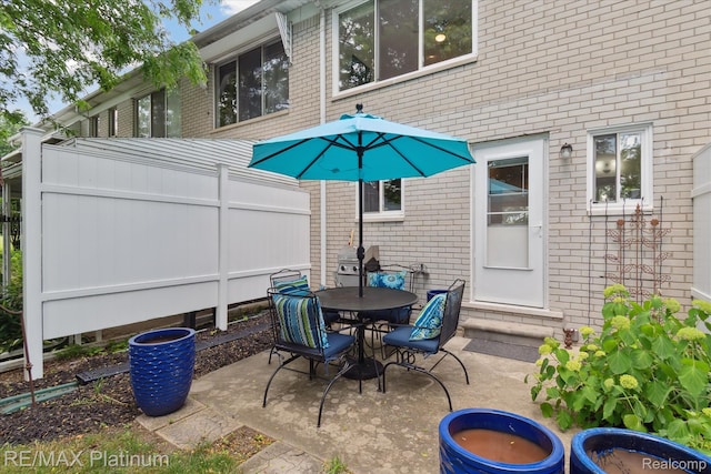 5959 Alan Dr Unit 53, Brighton, MI 48116 - view of patio / terrace featuring outdoor dining area and entry steps