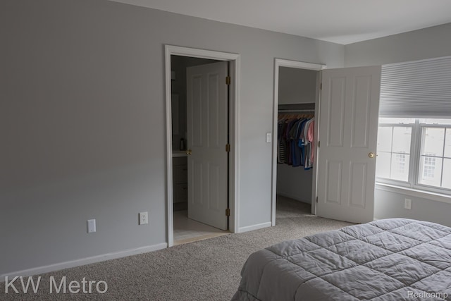 25493 Saint James, Southfield, MI 48075 - bedroom featuring light carpet, a walk in closet, a closet, and ensuite bath