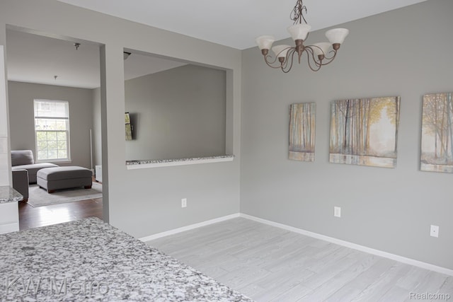 25493 Saint James, Southfield, MI 48075 - dining room with wood finished floors and a chandelier