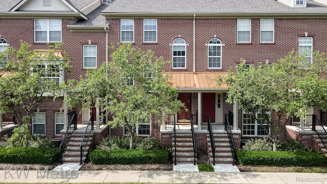 25493 Saint James, Southfield, MI 48075 - view of property with stairs, brick siding, a porch, and roof with shingles