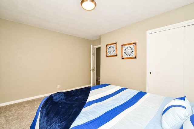 6604 E H Ave, Kalamazoo, MI 49048 - carpeted bedroom featuring a closet and baseboards