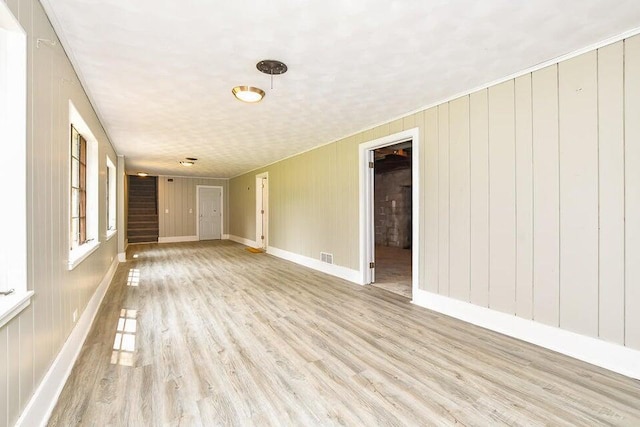 6604 E H Ave, Kalamazoo, MI 49048 - empty room with light wood-style flooring and stairs