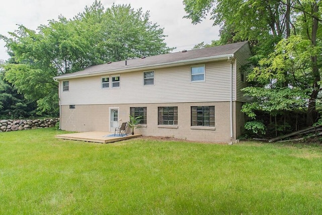6604 E H Ave, Kalamazoo, MI 49048 - rear view of property with a wooden deck and a lawn