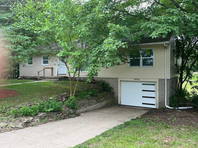 6604 E H Ave, Kalamazoo, MI 49048 - view of front of house with a garage and driveway