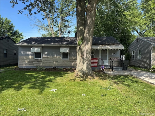 15684 Mcguire St, Taylor, MI 48180 - view of front of house with a front lawn and covered porch