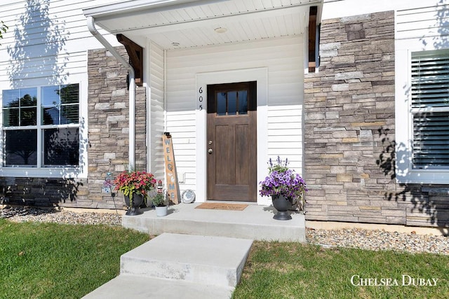 605 Bedford Falls Dr, Sparta, MI 49345 - doorway to property with stone siding