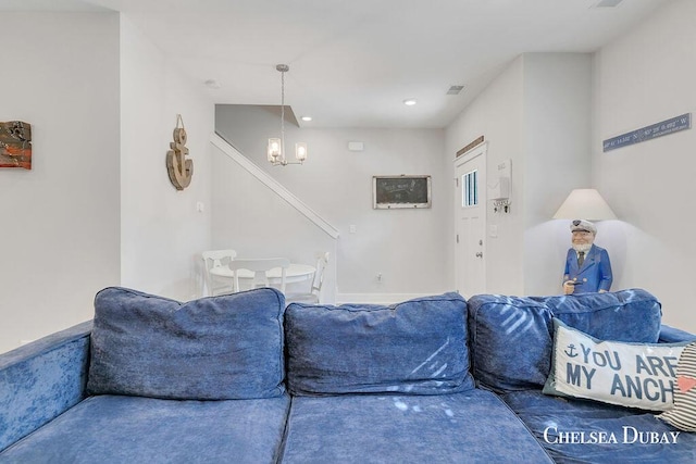 605 Bedford Falls Dr, Sparta, MI 49345 - living area with a chandelier