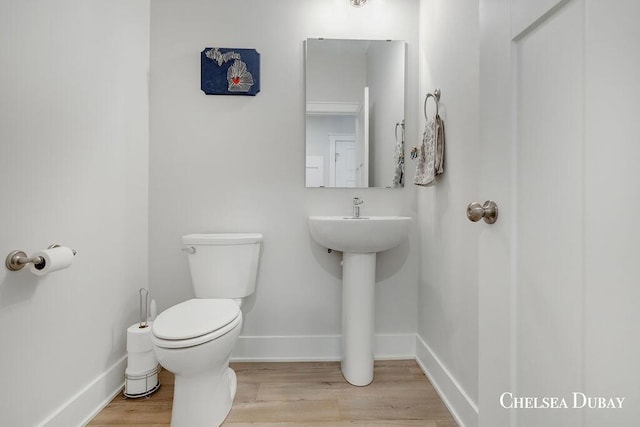 605 Bedford Falls Dr, Sparta, MI 49345 - bathroom featuring toilet and wood finished floors