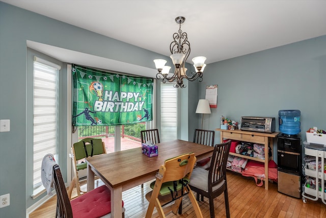2385 Yasmin Dr, Michigan, MI 48382 - dining area featuring a chandelier and light wood-style floors