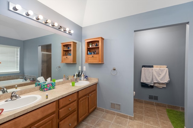 2385 Yasmin Dr, Michigan, MI 48382 - full bath with a garden tub, double vanity, a shower stall, and tile patterned flooring