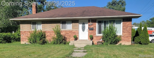 28406 Stuart Ave, Southfield, MI 48076 - bungalow-style house featuring a front yard, a chimney, brick siding, and a shingled roof