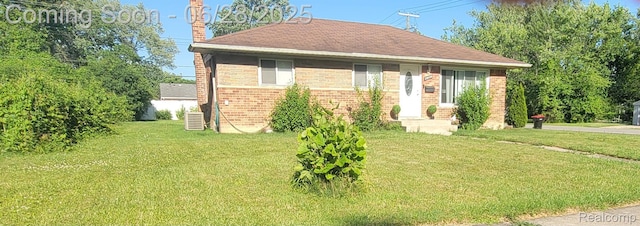 28406 Stuart Ave, Southfield, MI 48076 - view of front of property featuring a front lawn, a chimney, and brick siding