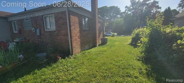 28406 Stuart Ave, Southfield, MI 48076 - view of side of home with a lawn and brick siding
