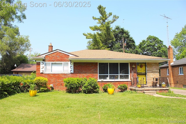 1902 Marlowe Dr, Flint, MI 48504 - bungalow-style home with a front lawn, brick siding, and a chimney