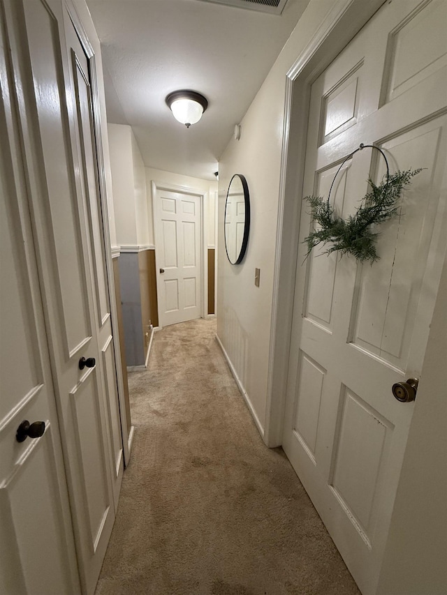 808 Stevens Dr, Owosso, MI 48867 - hall featuring light carpet and baseboards