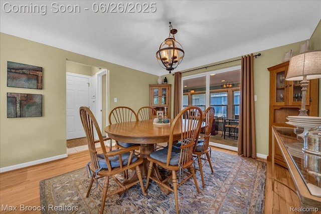 2425 Avondale St W, Sylvan Lake, MI 48320 - dining room featuring a chandelier and light wood finished floors